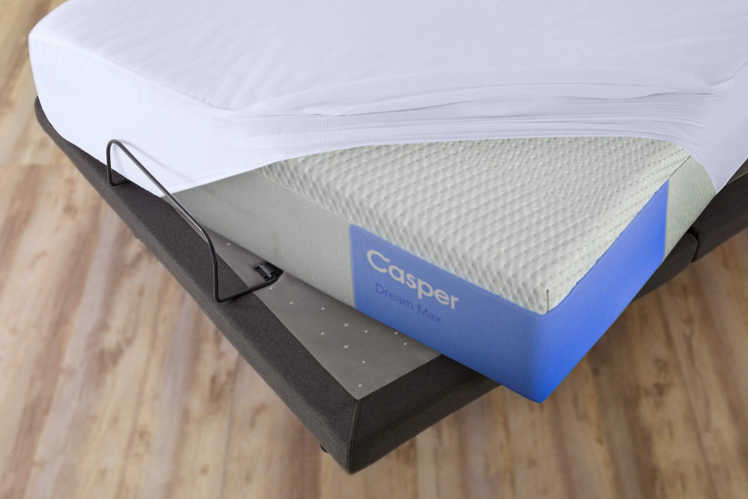 mattress protector covering a mattress on an adjustable bed frame