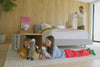 A father and his children enjoy their time in a bedroom on a Snow Max mattress.