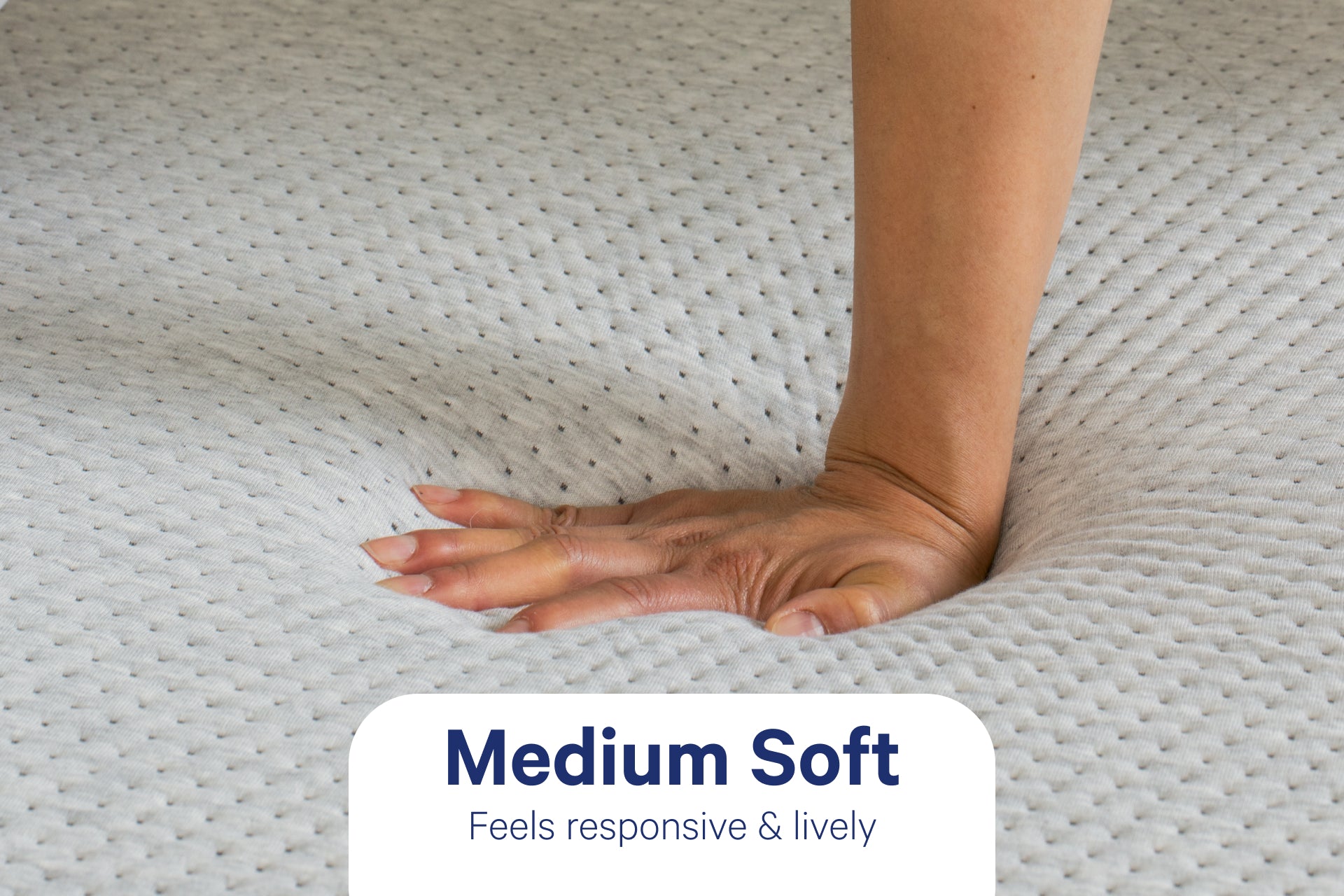 A person's hand pressed down to feel the Cloud One mattress. It is medium soft and feels responsive and lively.