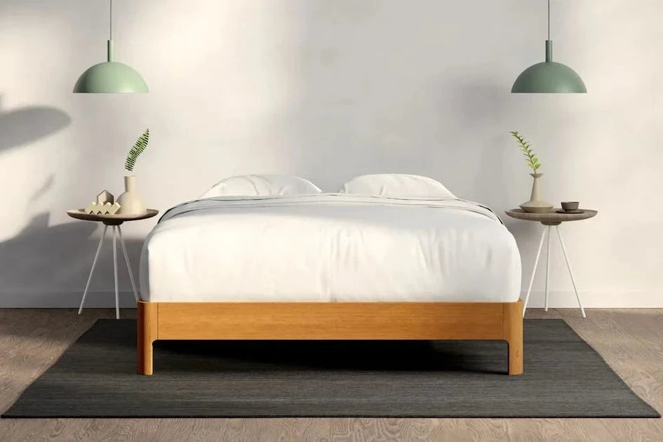 A fully made bed with a Repose Bed Frame. Front View.