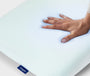 A hand feeling the Hybrid Pillow with Snow Technology.