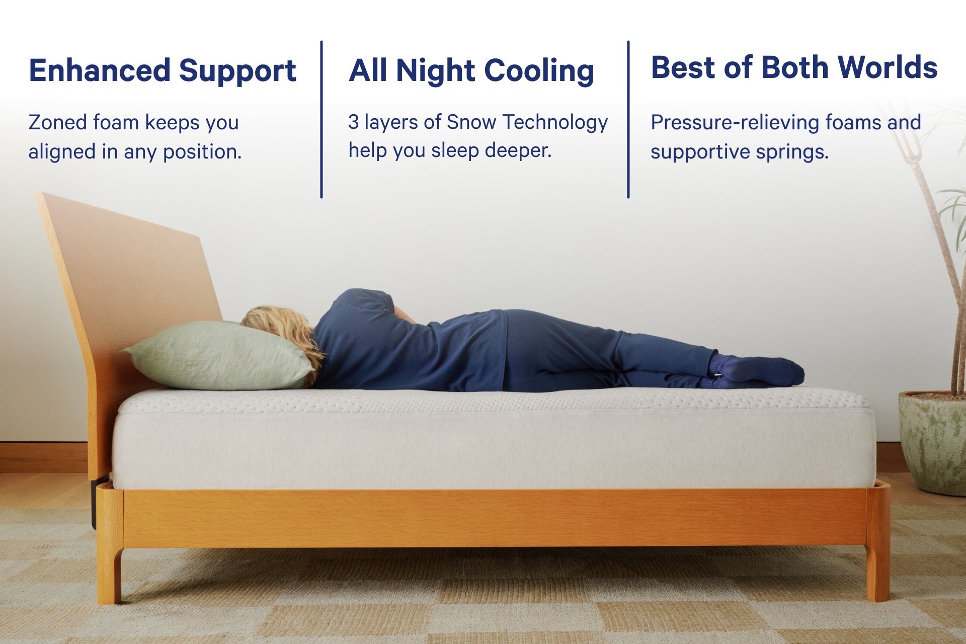 Bed with a person lying on it, highlighting features like enhanced support with zoned foam that keeps you aligned in any position. All night cooling has 3 layers of Snow Technology to help you sleep deeper. Best of both worlds with pressure-relieving foams and supportive springs.