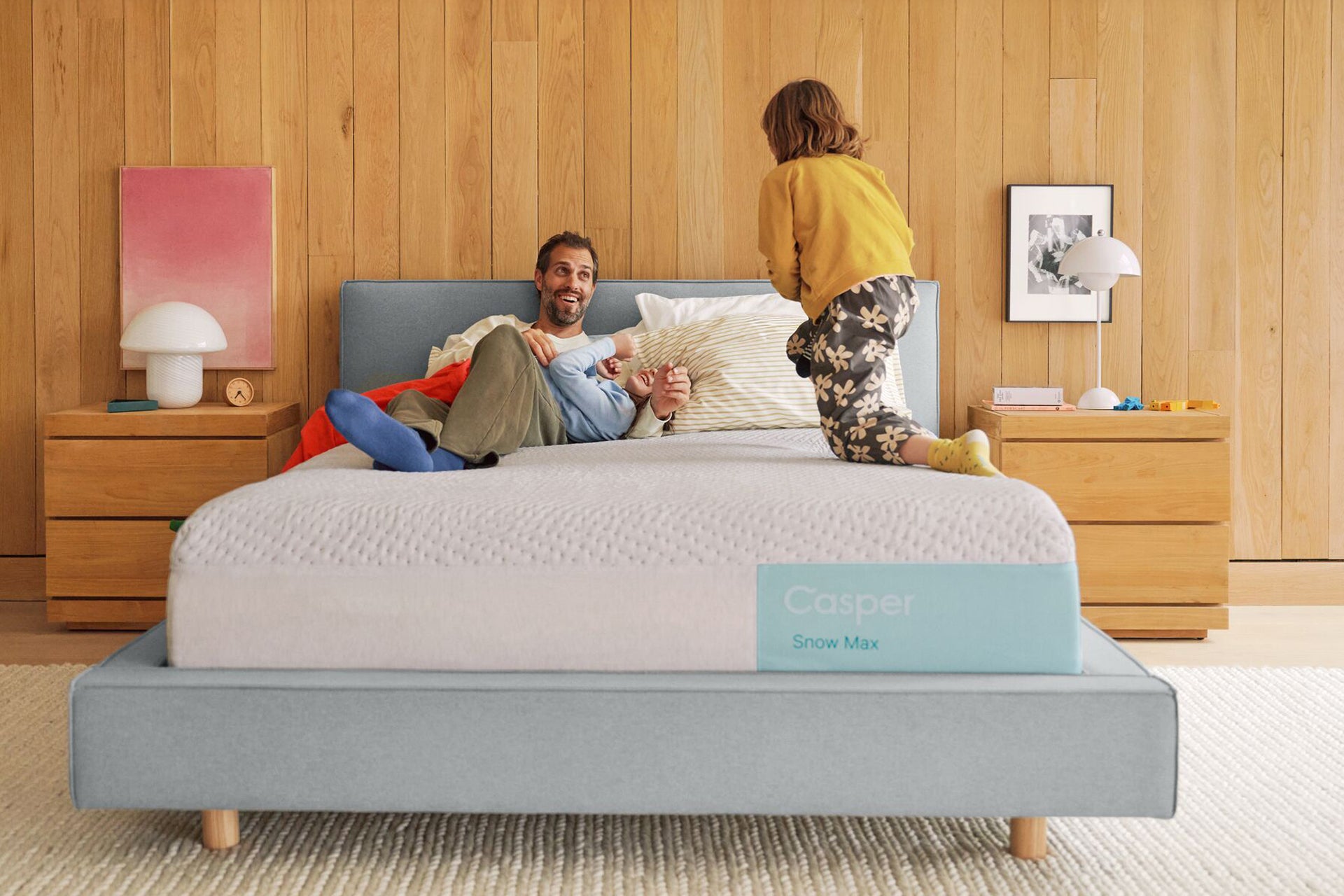A father and his children play happily on their Snow Max mattress.